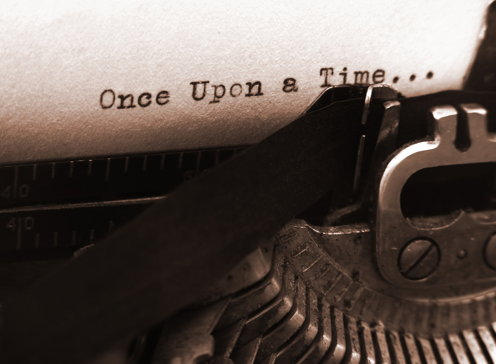 A photo of an old type writer with focus on the text